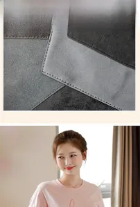 Detailed view of bicolor grey faux suede texture and premium stitching on fashion handbag
