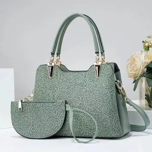 Ensemble sac à main vert à texture dentelle et mini pochette avec détails dorés