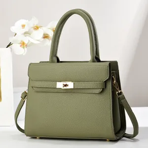 Large capacity lychee texture tote bag in deep green with classic metal lock and shoulder strap