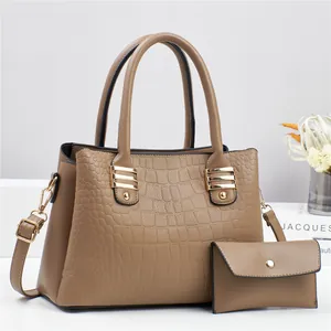 Brown crocodile pattern women's handbag set with matching envelope wallet and gold hardware