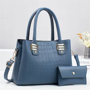 Navy blue crocodile pattern handbag and wallet set with gold hardware and strap