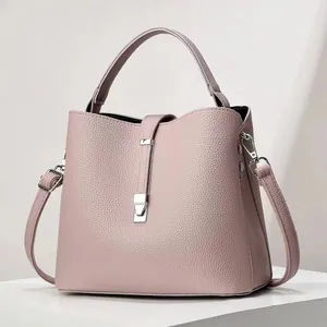 Pink lychee grain leather bucket bag with silver hardware and detachable strap