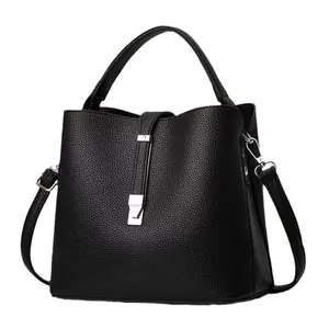 Elegant black lychee texture bucket bag with silver buckle and adjustable shoulder strap
