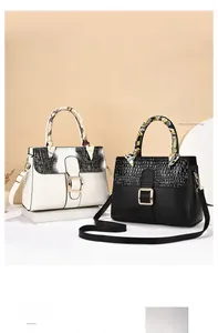 Detail of PU leather handbags featuring crocodile embossed flaps and decorative silk scarves