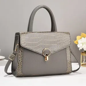Elegant grey faux leather handbag with crocodile pattern and golden metal lock detail