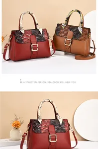 Detail of luxury PU leather bags with crocodile pattern lids and silk scarf handles