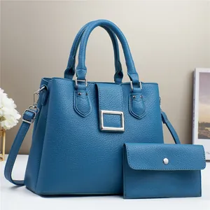 Elegant blue lychee leather tote bag set with metal buckle and shoulder strap for women