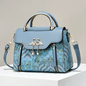 Blue Chinese vintage embroidered handbag with golden swan buckle and pearl tassels