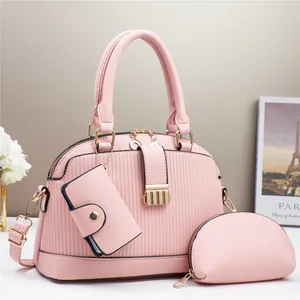Juego de 3 bolsos rosa tipo concha con correa ajustable y textura de cuero lichi