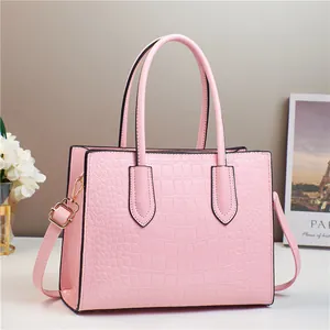 Pink faux crocodile leather handbag with adjustable strap and top handles for women