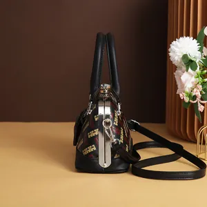 Vintage shell-shaped handbag with geometric print and leather handle in a soft room setting