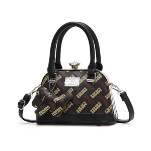 Black shell-shaped handbag with tricolor HHH monogram print and elephant charm