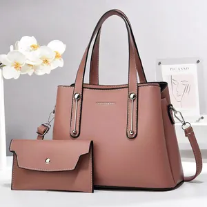Set borsa a mano in pelle testurizzata malva con portafoglio coordinato elegante
