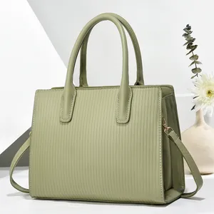 Minimalist light green tote bag with vertical stripes and gold metal hardware for women