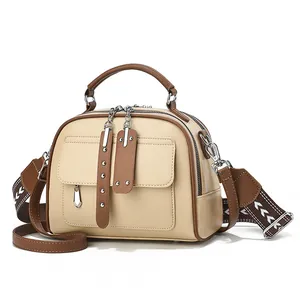 Chic beige and brown crossbody handbag with ethnic pattern wide strap and top handle