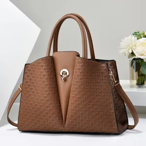 Brown handbag with woven texture panels, gold hardware and detachable shoulder strap