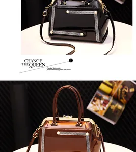 Macro detail of high-gloss patent leather handbag with vintage metal frame and greek patterns