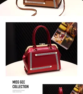 Detail of burgundy patent leather doctor bag featuring a decorative pearl meander pattern