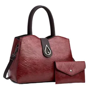 Ensemble sac à main et pochette vintage bordeaux avec fermoir métallique rétro