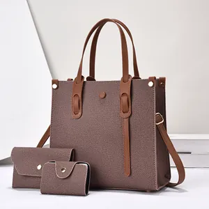 Three-piece trendy tote bag set with purple textured faux leather and gold hardware