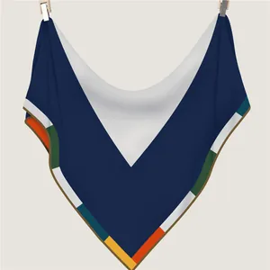 Winter geometric silk scarf in dark blue and orange with V-pattern and fine stitching