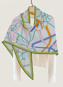 Close-up of a retro horse-head silk scarf with abstract patterns on a wooden hanger