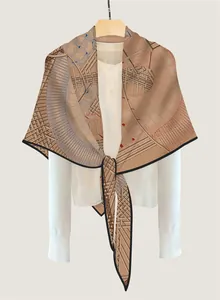 Detail of geometric pattern scarf tied over a white shirt showing texture and drape