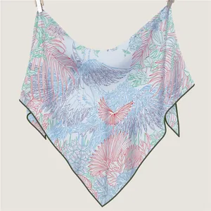 Versatile triangle shawl scarf with crane and tropical plant patterns in light blue fabric