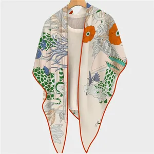 Silk feel shawl featuring artistic giraffe and floral prints with orange border details