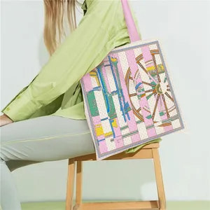 Detail of equestrian carriage pattern on large pink striped canvas tote bag