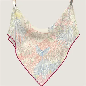 Tropical bird and palm leaf print silk scarf with deep red hand-rolled edges