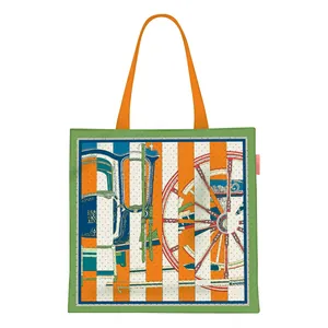 Detail of canvas tote bag showing orange straps and artistic horse carriage print