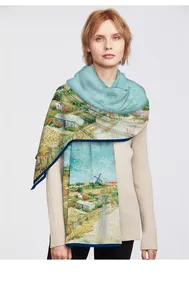 Detail of Van Gogh oil painting scarf styled on beige knitwear with blue border
