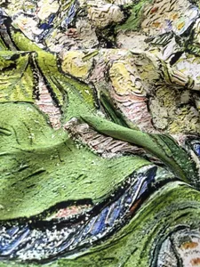 Macro view showing the artistic oil painting texture and silky drape of the square scarf