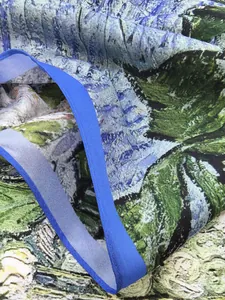 Detailed close-up of Van Gogh oil painting silk scarf with twill texture and blue border