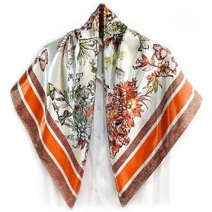 Detailed view of 90cm floral silk scarf with butterflies on white shirt