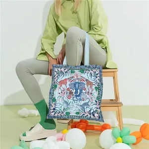 Artistic animal print canvas tote bag showcased by a model in a balloon-filled setting
