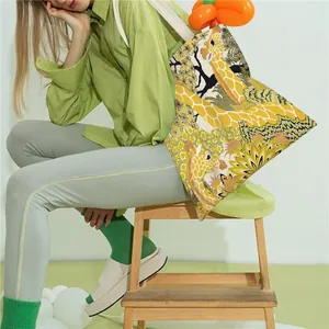 Close-up detail of high-quality giraffe print on a women's canvas tote shoulder bag