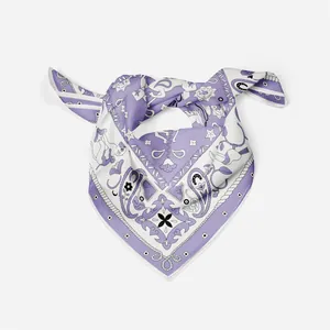 Detail of a purple satin silk scarf featuring exotic animal prints and floral patterns