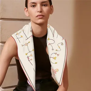 Premium double-sided silk scarf with floral print worn elegantly around the neck