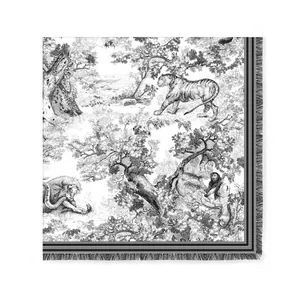 Detailed macro view of Toile de Jouy jungle animal print and tassel edges on scarf