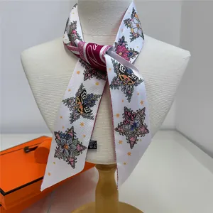 Floral tarot star silk twilly scarf with butterfly print and red border on model