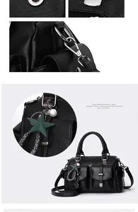 Detail view of black lychee grain leather tote with front flap pockets and star charm