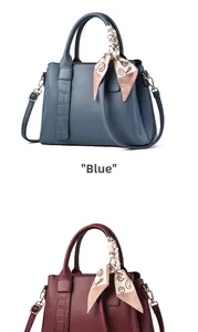 Detail view of blue and wine red leather handbags with elegant crocodile pattern texture