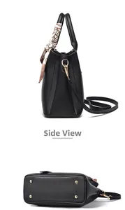 Detail view of black pebble leather tote with silk scarf handle and golden bottom studs