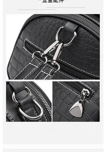 Detailed view of silver hardware and black crocodile embossed texture on shoulder bag