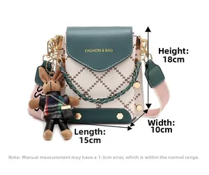 Detail view of mini crossbody bag with 18x15x10cm dimensions and rabbit pendant
