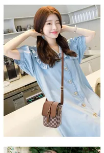 Brown checkered crossbody phone bag with multi-layer zipper and adjustable strap detail