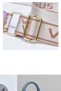 Detail of adjustable woven canvas strap with gold buckle and purple leather trim on handbag