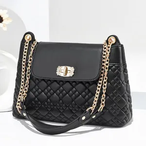 Quilted black leather shoulder bag with gold chain strap and rhinestone square lock
